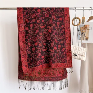 Elegant red paisley pattern scarf with long fringe tassels and soft cashmere-like texture