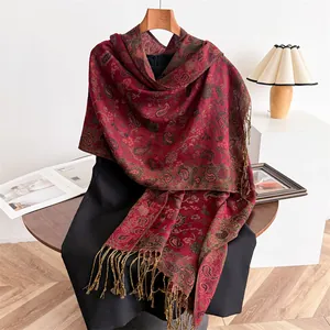 Elegant red paisley pashmina shawl with decorative tassels for winter