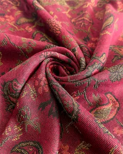 Close-up macro view of red paisley pashmina shawl showing elegant woven texture
