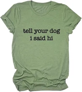 Close-up detail of a sage green cotton t-shirt with 'tell your dog i said hi' print