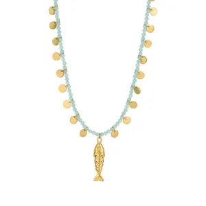 Detailed view of handmade natural stone necklace with golden fish and disk charms