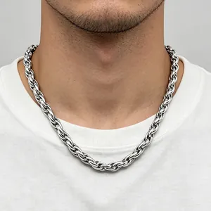 Close-up of chunky silver stainless steel twisted rope chain necklace worn on neck