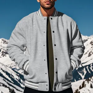 Close-up of a grey fleece varsity jacket with white striped ribbing and snap buttons