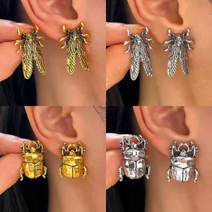 Vintage insect earrings set featuring gold and silver cicada and beetle jewelry designs