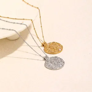 Stainless steel sun embossed coin pendant necklace set in gold and silver plating