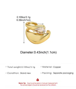Detailed macro view of gold water drop zircon ear cuff with dimensions and weight