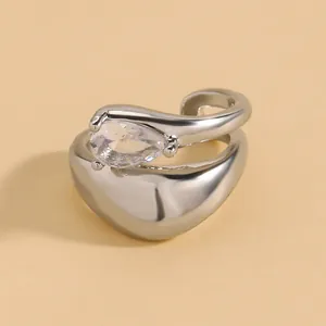 Close-up of silver-toned twisted ear cuff featuring a pear-shaped sparkling zircon