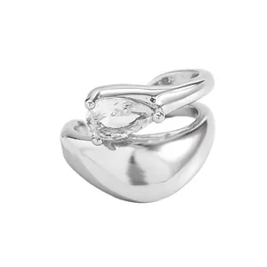 Detailed view of a silver-tone twisted line ear cuff with a teardrop cubic zirconia.