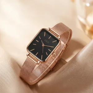 Elegant rose gold rectangular watch with black dial and stainless steel mesh strap.