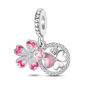 Sparkling silver cherry blossom dangle charm with pink enamel hearts and stones.