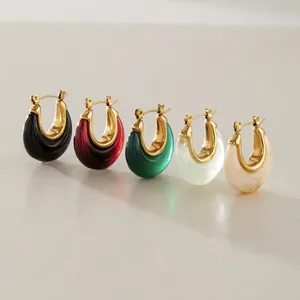 Macro view of colorful resin and gold-plated stainless steel hoop earrings set