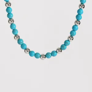 Close-up of bohemian turquoise and silver bead necklace jewelry details