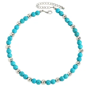 Detailed view of turquoise and silver beaded necklace with adjustable chain.