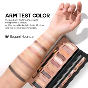 Close-up of 12-color eyeshadow swatches on arm showing matte and shimmer textures