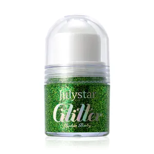 Gros plan professionnel de gel pailleté vert avec applicateur à bille pour le visage et corps