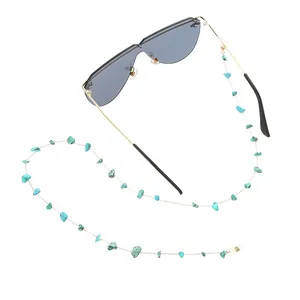 Detail view of turquoise stone beaded glasses chain with sunglasses