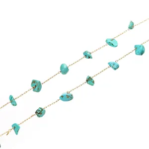High-quality close-up detail of irregular turquoise stones on a dainty gold eyeglass chain