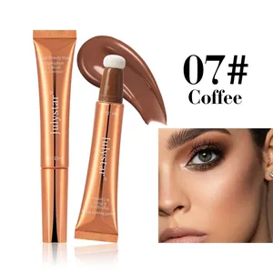 Close-up of Julystar liquid beauty wand in Coffee #07 with sponge applicator and swatch