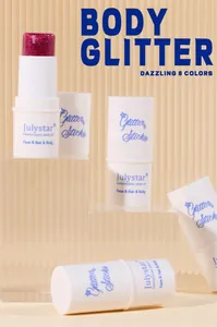 Close-up of dazzling Julystar body glitter sticks on clear acrylic display stands