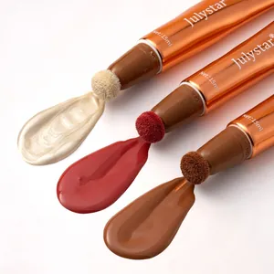 Close-up view of multifunctional liquid blush and highlighter wands with sponge heads