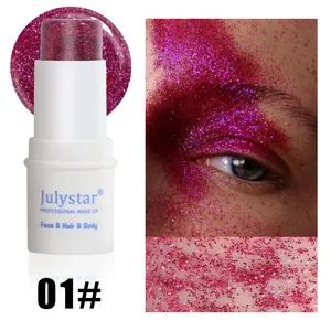 Close-up view of magenta glitter stick for professional face and body makeup application.