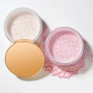 Macro detail of fine setting loose powder in pink and white jars with a luxury gold lid