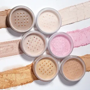 Detailed view of six shades of loose setting powder with corresponding swatches