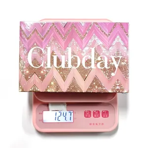 Detail view showing the 124.7g weight of the Clubday makeup palette on a pink scale