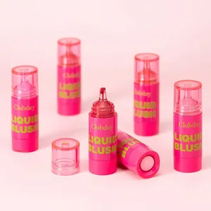 Close-up of liquid blush applicator showing vibrant red pigment drop