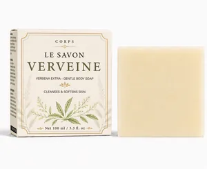 Detail view of handmade verbena body bar soap with elegant botanical paper box packaging