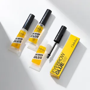 Close-up detail view of professional clear eyebrow glue tubes and styling brush wand