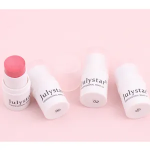 Detail view of Julystar cream blush sticks in various shades on pink background