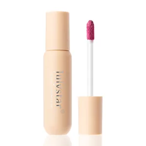 Detailed macro shot of Julystar liquid blush sponge applicator and peach matte bottle.