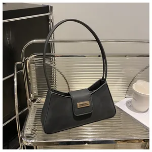 Minimalist retro black baguette shoulder bag featuring a stylish gold metal buckle accent
