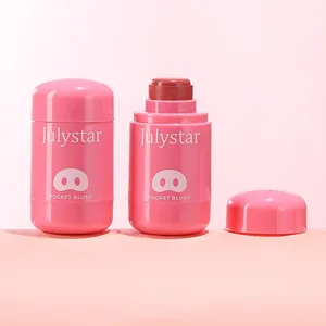 Detail view showing Julystar lip and cheek blush balm with cute pig-themed pink packaging