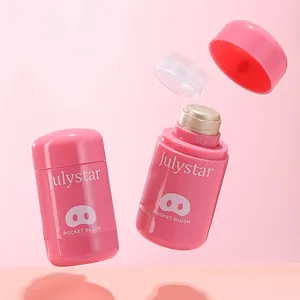 Macro view of Julystar pocket blush stick with shimmering cream texture and pink packaging