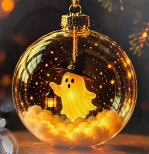 Detail shot of a glowing Halloween sphere ornament with a cute ghost figurine inside
