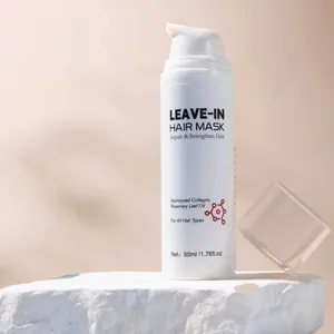 Detailed view of white 50ml leave-in hair mask bottle featuring rosemary leaf oil