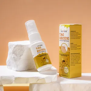 Detalle del spray reparador con veneno de abeja y caja de embalaje para verrugas