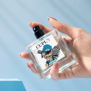 Close-up of CUPID Hypnosis pheromone-infused eau de parfum 50ml spray bottle held in hand
