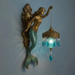 Vintage bronze mermaid wall lamp with blue crystals and nautical ocean theme decor