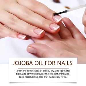 Jojoba oil for nails being applied to strengthen and moisturize dry and brittle cuticles.