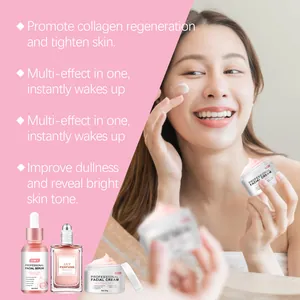 Mujer asiática aplicando crema facial rosa de un set de regalo hidratante con perfume
