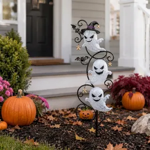 Halloween solar ghost garden stake lights illuminating an autumn backyard landscape