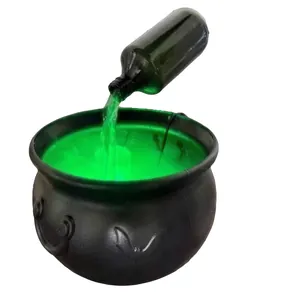 Classic Halloween witch cauldron indoor decoration featuring green glowing mist effect