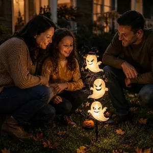 Solar-powered Halloween ghost garden stake light with glowing family outdoor scene