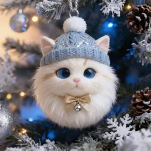 Close-up detail of a fluffy white cat head ornament wearing a blue knitted hat and gold bow
