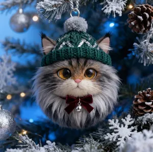 Detail of cute fluffy cat ornament with green knit hat and red bow for Christmas tree