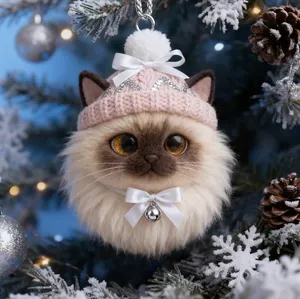 Close-up of a cute plush cat Christmas ornament with a pink hat and white bow