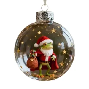 Bola de Navidad transparente con una linda rana de Papá Noel y estrellas doradas